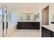 Bathroom featuring a double vanity, soaking tub, and walk-in shower at 12546 Mosticone Way, Las Vegas, NV 89141