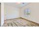 Bright bedroom with neutral carpet and large window at 12546 Mosticone Way, Las Vegas, NV 89141