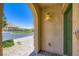 Covered front entrance featuring stone accents and exterior lighting at 12546 Mosticone Way, Las Vegas, NV 89141