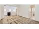 Open hallway with access to a bathroom and bedrooms, featuring modern carpet and ample natural light at 12546 Mosticone Way, Las Vegas, NV 89141