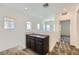 Bright hallway featuring a built-in cabinet and neutral-toned carpeting, offering a clean and modern aesthetic at 12546 Mosticone Way, Las Vegas, NV 89141
