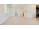 Spacious living room with neutral paint, tile floors and several interior doorways at 12546 Mosticone Way, Las Vegas, NV 89141