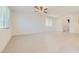 Spacious living room with large windows and neutral paint providing lots of natural light at 12546 Mosticone Way, Las Vegas, NV 89141