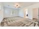 Spacious main bedroom with ceiling fan and a view of the bathroom at 12546 Mosticone Way, Las Vegas, NV 89141