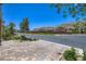 View of a well-maintained neighborhood with lush landscaping at 12546 Mosticone Way, Las Vegas, NV 89141