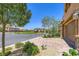 View of a well-maintained neighborhood with lush landscaping at 12546 Mosticone Way, Las Vegas, NV 89141