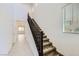 Bright staircase featuring tile floors, neutral paint, and carpeted stairs at 12546 Mosticone Way, Las Vegas, NV 89141