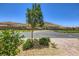 Street view featuring lush landscaping and a view of the homes, and the mountains in the distance at 12546 Mosticone Way, Las Vegas, NV 89141