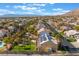 Aerial shot featuring solar panels, a pool, and mature palm trees in a well-maintained neighborhood at 1407 Fields St, Las Vegas, NV 89142