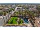 An aerial view shows a home with a backyard featuring a pool, spa, and generous turf in a neighborhood at 1407 Fields St, Las Vegas, NV 89142