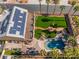 Aerial view showcases the backyard pool, spa, fire pit, outdoor seating, and solar panels at 1407 Fields St, Las Vegas, NV 89142