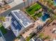 An aerial view shows a home with solar panels, an artificial lawn, a pool and hot tub, and a fire pit at 1407 Fields St, Las Vegas, NV 89142