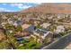 Beautiful aerial shot showcases the property, pool and stunning mountain views at 1407 Fields St, Las Vegas, NV 89142