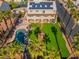 Expansive backyard features a sparkling pool, manicured lawn, and covered patio at 1407 Fields St, Las Vegas, NV 89142