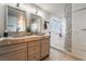 Updated bathroom featuring double vanities and an updated shower at 1407 Fields St, Las Vegas, NV 89142