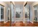 Mirrored hallway leading to updated bathrooms featuring double vanities at 1407 Fields St, Las Vegas, NV 89142