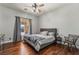 This bedroom features hardwood floors, a queen bed, and neutral paint at 1407 Fields St, Las Vegas, NV 89142