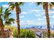 Distant view of the city skyline framed by palm trees from an elevated position on a clear, sunny day at 1407 Fields St, Las Vegas, NV 89142