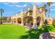 Beautiful home with a spiral staircase leading to the upper level, and a well-manicured lawn at 1407 Fields St, Las Vegas, NV 89142
