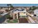 Beautiful two-story home featuring solar panels, a two-car garage, desert landscaping and an expansive city view at 1407 Fields St, Las Vegas, NV 89142