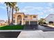 Inviting two-story home features a three-car garage and well-maintained landscaping at 1407 Fields St, Las Vegas, NV 89142