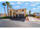 Inviting two-story home features a three-car garage and well-maintained landscaping at 1407 Fields St, Las Vegas, NV 89142
