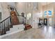 Welcoming foyer with hardwood stairs, high ceilings, and an elegant front door with sidelights at 1407 Fields St, Las Vegas, NV 89142