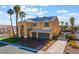Beautiful two-story home featuring a three-car garage, and mature palm trees at 1407 Fields St, Las Vegas, NV 89142