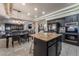 Open-concept kitchen with stainless steel appliances, a center island, and dining area at 1407 Fields St, Las Vegas, NV 89142