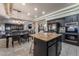 Open-concept kitchen with stainless steel appliances, a center island, and dining area at 1407 Fields St, Las Vegas, NV 89142