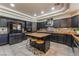 Beautiful kitchen with stainless steel appliances, a kitchen island, and modern lighting fixtures at 1407 Fields St, Las Vegas, NV 89142