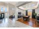 Bright open living space features tile flooring, high ceilings, and a dining area with hardwood floors at 1407 Fields St, Las Vegas, NV 89142