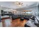 Open living room with hardwood floors and views of kitchen and backyard at 1407 Fields St, Las Vegas, NV 89142