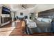 Large main bedroom featuring hardwood floors, a desk, and a media center at 1407 Fields St, Las Vegas, NV 89142