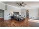 Spacious main bedroom featuring hardwood floors, a ceiling fan, and neutral paint at 1407 Fields St, Las Vegas, NV 89142