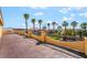 Expansive patio offering neighborhood views with a green space with palm trees at 1407 Fields St, Las Vegas, NV 89142