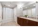 Spacious bathroom features double sinks with granite countertops, tile flooring, and a shower-tub combo with shower curtain at 150 Las Vegas Blvd # 1608, Las Vegas, NV 89101
