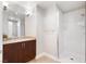 Bathroom featuring a granite countertop with a modern bowl sink and a walk in shower with a glass door at 150 Las Vegas Blvd # 1608, Las Vegas, NV 89101