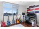 This room is decorated with musical instruments and a desk facing a bright window showcasing a cityscape view at 150 Las Vegas Blvd # 1608, Las Vegas, NV 89101