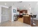 Contemporary kitchen features wooden cabinets, stainless steel appliances, and a granite countertop bar with stool seating at 150 Las Vegas Blvd # 1608, Las Vegas, NV 89101