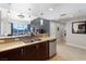 Kitchen with bar seating and stainless steel appliances open to the living area at 150 Las Vegas Blvd # 1608, Las Vegas, NV 89101