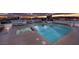 Rooftop pool and spa with lounge chairs, illuminated with city skyline backdrop at 150 Las Vegas Blvd # 1608, Las Vegas, NV 89101