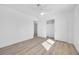 Bright bedroom features natural light, neutral walls, wood floors, closet and a ceiling fan at 1616 Yellow Rose St, Las Vegas, NV 89108