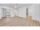 Bright bedroom with wood-look floors, ceiling fan, and plenty of natural light at 1616 Yellow Rose St, Las Vegas, NV 89108