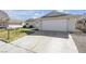 Charming single-story home featuring a two-car garage and manicured front yard at 1616 Yellow Rose St, Las Vegas, NV 89108