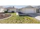 Inviting single story home with well-maintained lawn and charming curb appeal at 1616 Yellow Rose St, Las Vegas, NV 89108