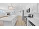 Modern kitchen featuring stainless steel appliances and a stylish center island at 1616 Yellow Rose St, Las Vegas, NV 89108