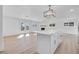 Bright living room featuring open floorplan, fireplace, and kitchen island at 1616 Yellow Rose St, Las Vegas, NV 89108
