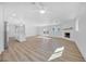 Spacious living area with fireplace, ceiling fan, and french doors to the backyard at 1616 Yellow Rose St, Las Vegas, NV 89108