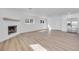Bright living room featuring fireplace and white walls and laminate floors at 1616 Yellow Rose St, Las Vegas, NV 89108